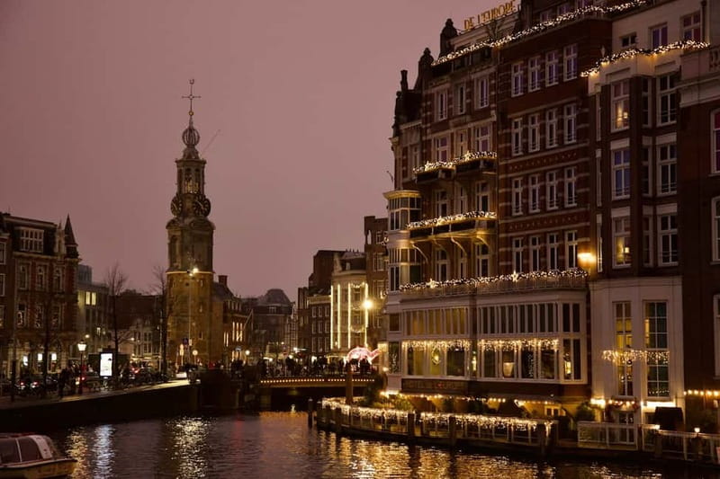 Amsterdam: Iconic Canals & Historic Sights Walking Tour - Begijnhof and a quieter side of central Amsterdam