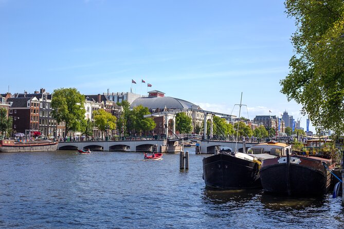 Amsterdam Walking Tour: Urban Legends & History with local guide - Starting beside the Amstel at the Skinny Bridge