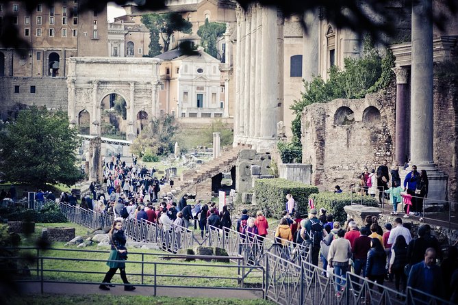 Ancient Rome Guided Tour: Colosseum, Forum and Palatine & Pick Up - Walking the Via Sacra into the Roman Forum