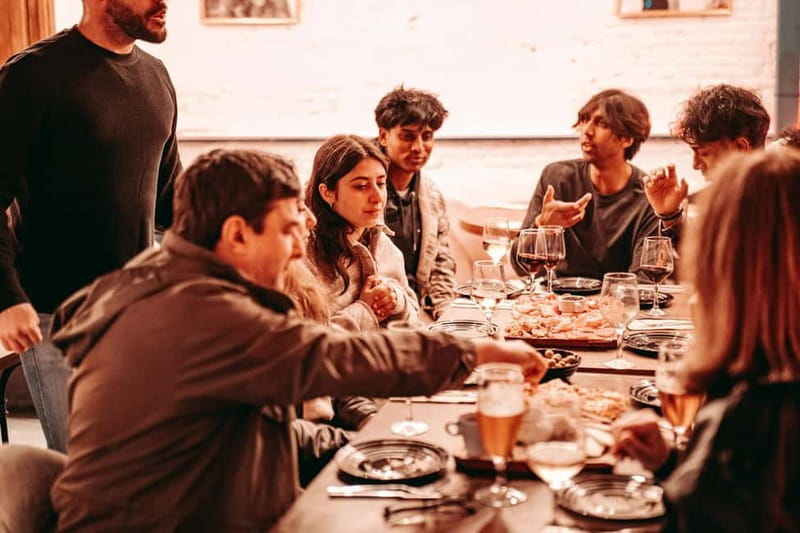 Barcelona: Tipsy Tapas & History Tour in the Gothic Quarter - Walking through the Gothic Quarter between bites