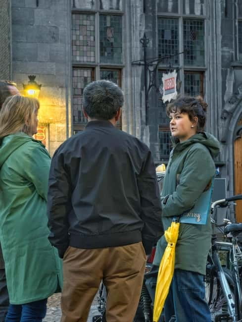 Bruges: Nightly Tales and Untold History Walking Tour - Sint-Jansplein, chocolate, and the old commercial city