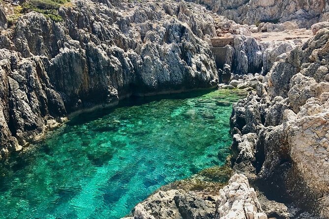 Chania: Hiking through History and Hidden Gems at Katholiko Bay - Caves, rock formations, and the clear water below