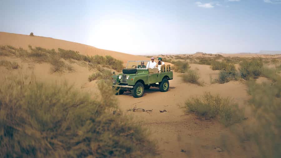 Dubai: Heritage Desert Safari wtih Overnight and Breakfast - Riding through the reserve in a classic Land Rover