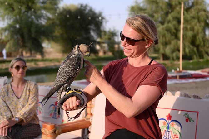 Dubai: Morning Heritage Safari by Vintage G Class & Al Marmoom Oasis - Arabic coffee, clothing, and falcon photographs