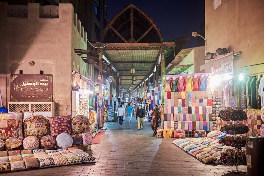 Historic Forts, Boats and Pearls of Old Dubai Walking Tour - Crossing Dubai Creek by traditional abra
