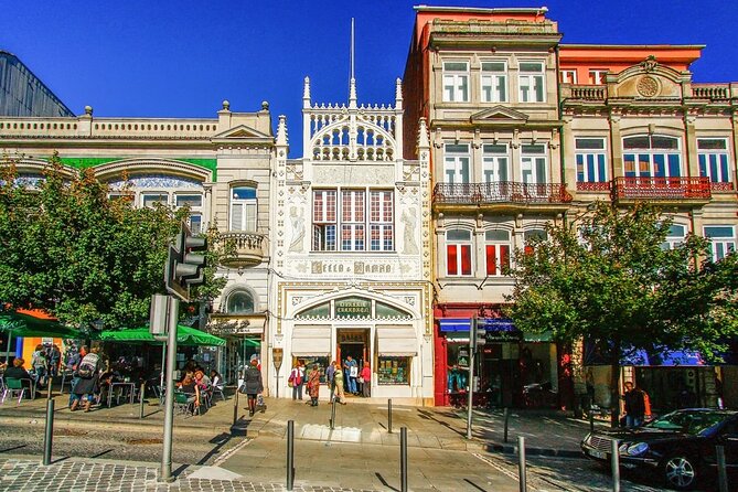 Historic Porto by Private Electric Tuk Tuk to Top Landmarks - Carmelitas Church and the Clérigos skyline
