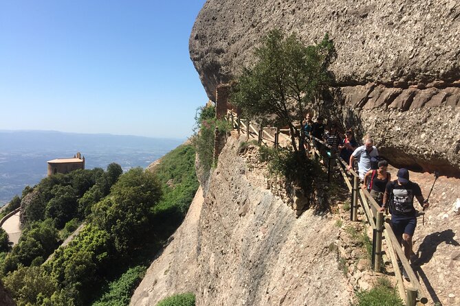 Historical Montserrat Half-Day Hiking Tour from Barcelona - Riding the Sant Joan Funicular into the mountains