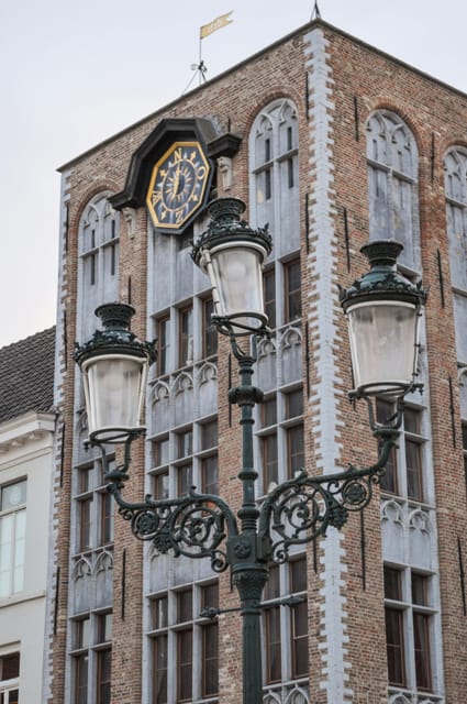 Historical walk in Bruges with local guide. Praline included - Burgundy Wall Square, restaurants, and brewery culture