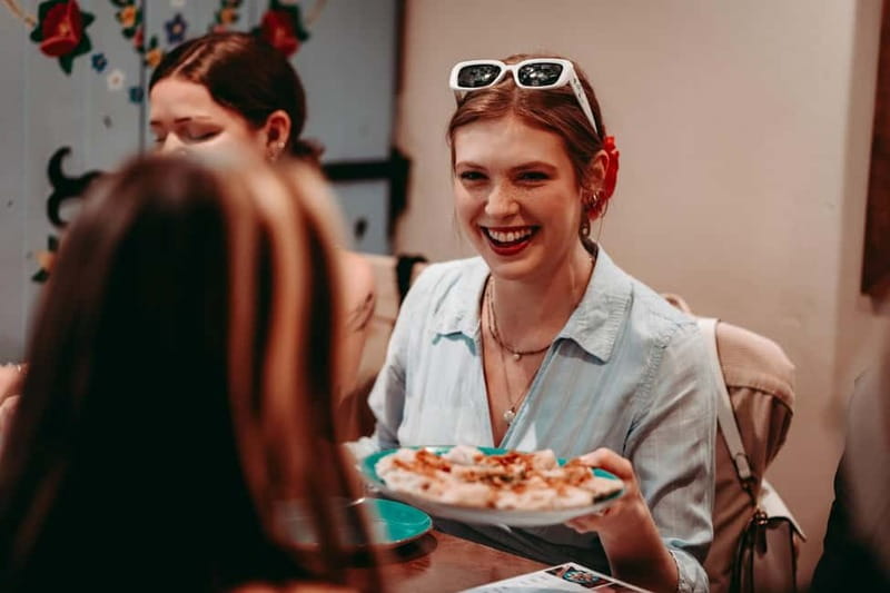 Krakow: Tipsy Polish Food Tour With History, Pierogi & Shots - Starting with a pretzel and a taste of Poland