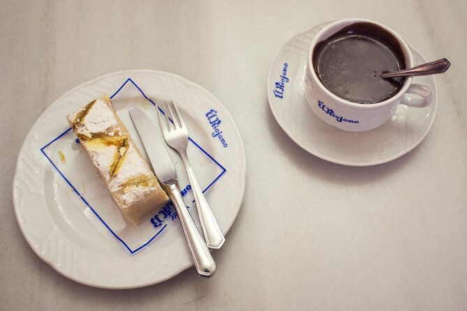 Madrid Historic Centre Food Tour with Authentic Tapas & Wines - The opening pastry at a historic bakery