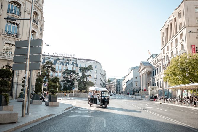 Madrid Historical Tour with Local Guide in Eco Tuk Tuk Private - The first stop: a covered market with local flavor
