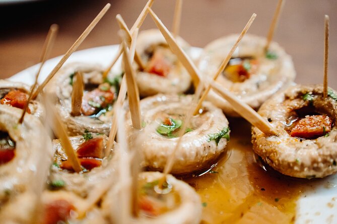 Madrid Tapas & Taverns Small Group Food & History Tour - El Escarpín and the theater of Asturian cider