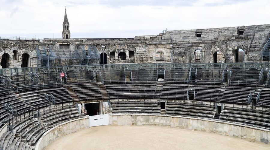 Nimes: Ancient Roman Arena Ticket & Old Town Audio Tour - Why the arena is still part of city life