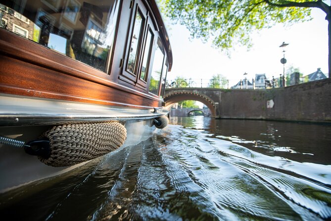 Private Boat Tour Amsterdam - 90 Min incl. welcome drink on historic saloon boat - Drinks, comfort, and the onboard mood