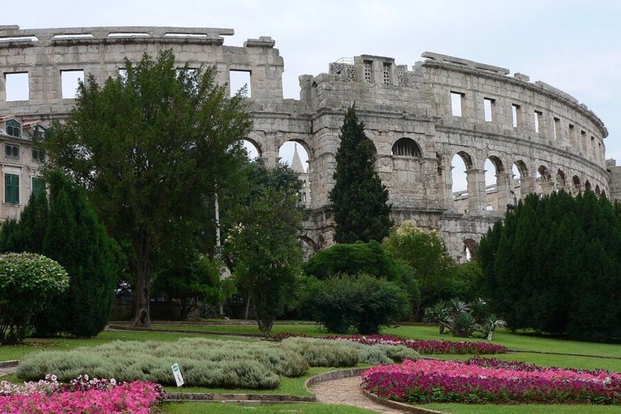 Pula: Historic Walking Tour with Local Guide & City Views - Reading Pula through Forum Square