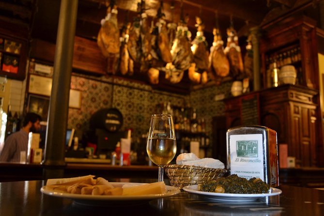 Sevilla Food Tour: Tapas, Wine, History & Traditions - Flamenco dresses at Plaza del Pan