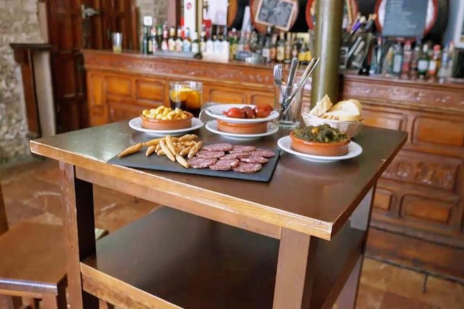Sevilla Food Tour: Tapas, Wine, History & Traditions - Walking through Seville’s old center