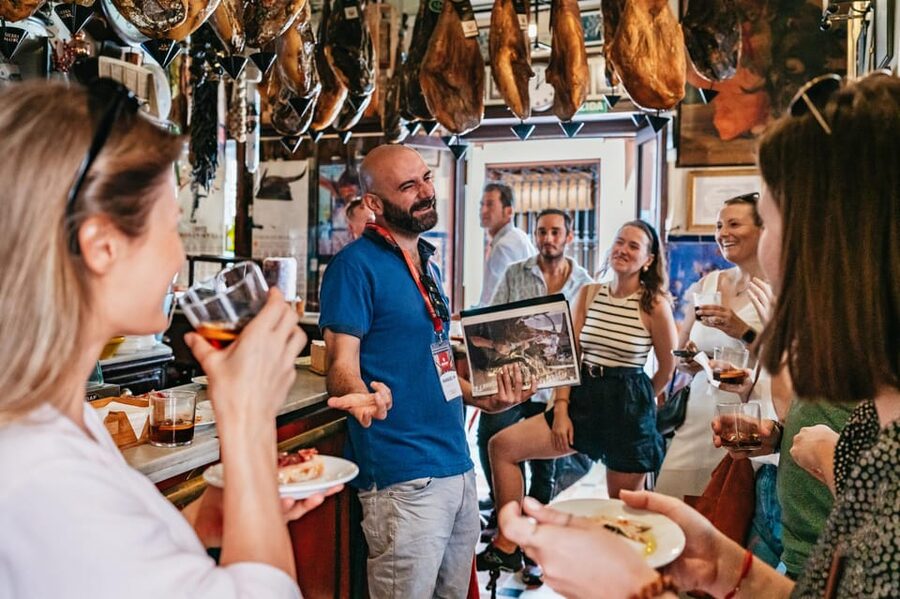 Seville: Tapas, Taverns and History Guided Walking Tour - Walking from the Jewish Quarter toward Arenal