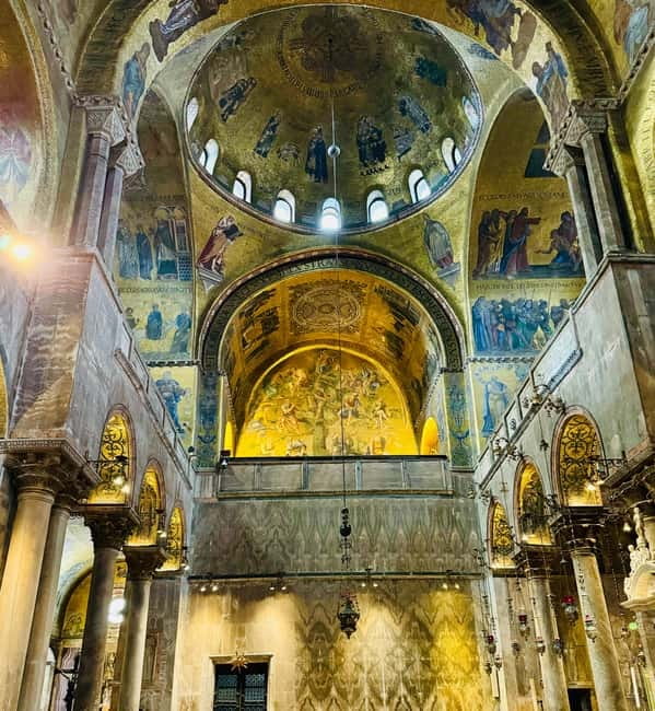 Venice: The History of St. Mark's Basilica Tour - Meeting the escort beside the two lions